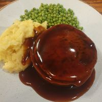 Mushroom bourguignon pie, slow-cooked mushrooms & caramelised onion in a rich red wine gravy, wrapped in shortcrust pastry, with mashed potatoes and garden peas (specify VE option  at The Old Boat House in Manchester