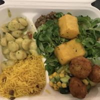Potato gnocchi, rice, lentils, a cucumber corn salad, and some other things I don’t remember under the greens.  at Ops Cucina Mediterranea in Rome