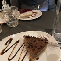 Vegan cheesecake and dark chocolate cake at Ops Cucina Mediterranea in Rome