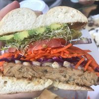 Vegan Tempeh burger on bagels ( burger buns not vegan) at Sprouts Natural Foods Cafe in South Lake Tahoe