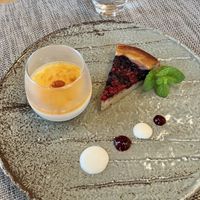 Blueberry and raspberry cake, almond tofu with apricot sauce, garnished with  homemade yogurt and blueberry jam.   at Pas a Pas in Miyota