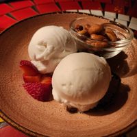 Coconut ice cream with fruit and cashews at Kloof Street House in Cape Town