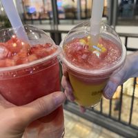 Left side is a Watermelon Smoothie-O with added strawberries on top (extra). Yummy! Hit the spot.   at Mango Mango Dessert in Honolulu