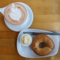 hot chocolate with oat milk and a whole wheat bagel with hummus at White Rabbit Book Cafe in Oregon City