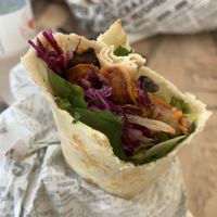 My salad wrap with all salads, pineapple, grilled eggplant, sweet potato and sweet chilli sauce  at Crumbed Or Naked in Mooloolaba