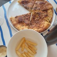 Rosemary & confit garlic flatbread (vg), Chips+ dipping sauce that isn't vegan so don't consume it at Riverbar & Kitchen in Brisbane