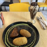 A special they had of 3 empanadas with different fillings including vegan cheese and chorizo served with fries (not pictured) and a brownie milkshakee  at ChapiYork in Bogota