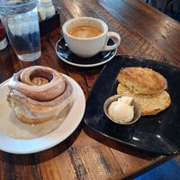 Cinnamon roll, cheesy vegan biscuits with butter, oatmilk latte at Seven Mile Cafe in Mesquite