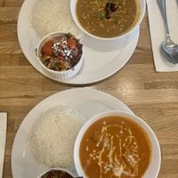 Butter chicken combo (front), grandmas coconut curry (back) - bread not pictured   at Tula in Montreal