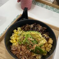 Vegetarian poke bowl. Avo, mushroom, sweet corn, pineapple, crispy onion, spring onion, brown rice. Berry shake. Delicious  at Fresh & Fit Cafe in Phuket