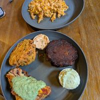 Chipotle Mac and cheeze, potato croquet, potato cake, and enchilada with cilantro crema at Boots Bakery & Lounge in Spokane