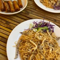 Spring rolls with chilli sauce dip, and fried noodle with mushroom and vegan ham at Nhà hàng chay Veggie Saigon - Vietnam Vegan Heritage in Hoi An