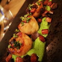 King oyster mushroom 'scallops' with b*con, vegan black pudding and minted pea puree at Reishi Plant Kitchen in Worcester