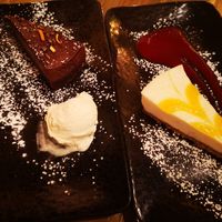 Chocolate and clementine torte with ice cream, and lemon cheesecake with berry coulis at Reishi Plant Kitchen in Worcester