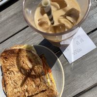 Vegan cheese and tomatoes toasties and soya caramel iced latte   at The Courtyard Cafe in Bristol