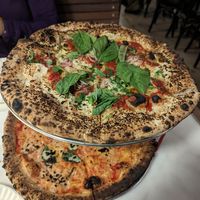 Onion pie on top and vegan margherita on the bottom at Ollie's Pizza in High Falls