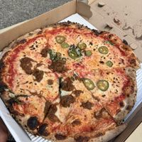 2 halves of diff vegan pies assembled into one   at Ollie's Pizza in High Falls