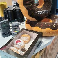 box with 4 donuts at MEL - Daniel's Donuts - T4 & T1 in Melbourne