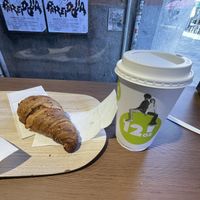 Vegan croissant and soy cappuccino  at 12oz Street Coffee in Venice