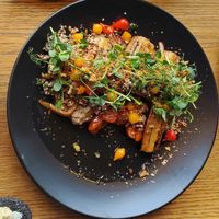 Entree of Smoked Parsnips over Baba Ganoush topped with a Quinoa and Pomegranate Salad. (V) at Lóa in Reykjavik