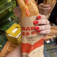 Egg and cheese, too good to not take a bite before pics   at Bánh mì cô Chun  in Hanoi