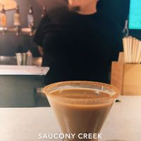 The artwork (espresso martini) and the artist. I brought my own soy milk to sub out the half and half they used for it  at Saucony Creek Brewing in Kutztown