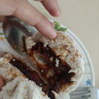 Oat bun with glazed mushrooms at Sutunthip Vegetarian Food in Bangkok
