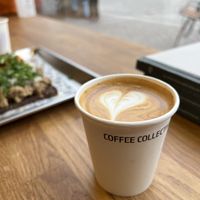 Flat white, taken-away to drink next door at Røst  at Coffee Collective Torvehallerne in Copenhagen