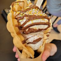 Bubble waffles with cherry and choc chip ice cream (bottom), biscoff ice cream, chocolate sauce, rainbow sprinkles (requested no squirty cream) at Lick in Bakewell
