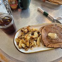 Vegan blueberry pancakes, potato hash, cold brew coffee at Succotash in Kansas City