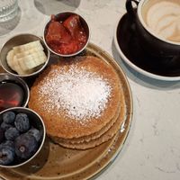 Vegan pancakes with blueberries, maple syrup, bananas, compote at Brunchoteket in Malmo