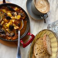 Vegan shakshuka served with sourdough. Mocha with soya milk at Farm Kitchen in Southsea