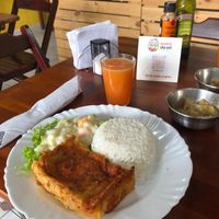 The Saturday plate of Vegan Lasagna with homemade vegan cheese, banana compote, acerola juice all included in the price of the plate at Bistrô da Vó in Pindamonhangaba
