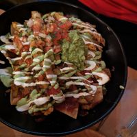 Vegetarian nachos with regular cheese and vegan chicken at Ranchos Cocina in San Diego