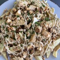 Patatas a la parmesana  at Rúkula Vegan Food in Malaga