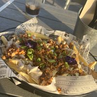 Tofu cheese fries   at Rúkula Vegan Food in Malaga