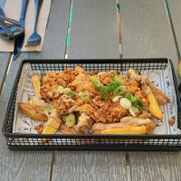 Parmesan chips with smoked tofu and cheese sauce. Amazing!!!! at Rúkula Vegan Food in Malaga