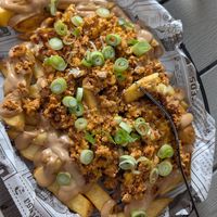 Tofu cheese fries at Rúkula Vegan Food in Malaga