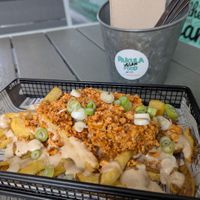 Tofu-cheezy fries at Rúkula Vegan Food in Malaga