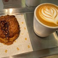 Pain au chocolat and flat white   at Buddy Buddy in Paris