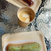 Caramel and pistachio eclairs at Eclair Lab in Warsaw