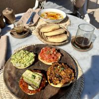 Hummus and vegan starters with bread  at Atay Cafe in Marrakech