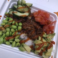 Jasmine rice, bbq jackfruit, cucumbers, tomatoes, edamame beans, avocado & siracha   at Space Bowl Bistro in Merritt Island