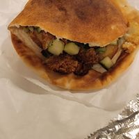 Pita with Falafel, Cucumbers, Cauliflower, Potatoes at Shawarma Joint in Champaign