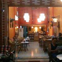 Inside the coffee, nice and cosy decoration, some books... at Cafe Soleil in Phnom Penh