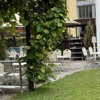 Food bar and more outdoor seating  at Schlosscafé im Palmenhaus in Munich