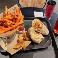 Fake chicken wrap, sweet potato fries, kombucha at Veg Stop in Riga