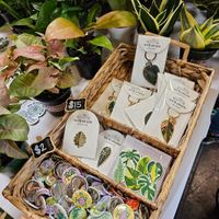 Keychains and pins at Hella Plants Market in Oakland