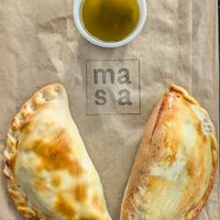 empanadas and chimichurri at Masa Empanadas in Portland