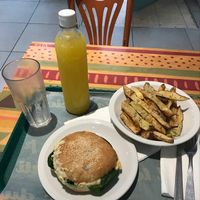 sándwich de zucchini con jugo de naranja con gengibre y papas rústicas at VITA - Hipolito Yrigoyen in Buenos Aires